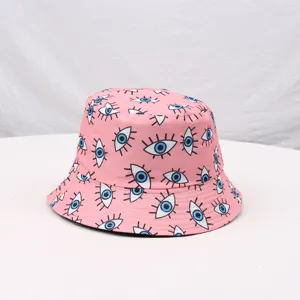 Pink printed bucket hat with eye patterns, ideal for outdoor travel, sun protection and daily.