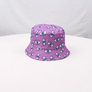Purple bucket hat featuring an all-over blue and white eye print pattern for outdoor sun wear.