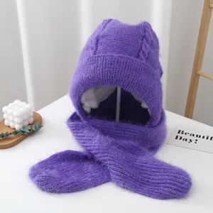 Detailed view of the cozy purple fleece-lined knit hat and scarf combo for winter warmth.