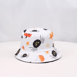 Detail view of the Halloween spider and pumpkin print fabric pattern on the white bucket hat.