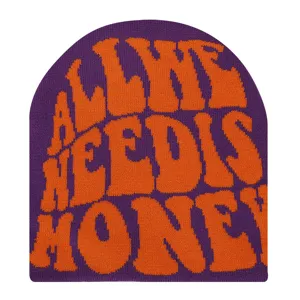 Purple knitted beanie with slogan text detail, cozy winter headwear fashion piece.