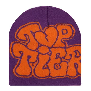 Purple knit beanie featuring a bold orange graffiti graphic design for stylish winter wear.