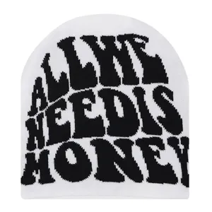 Detailed view of white knit beanie featuring bold black slogan text, cozy winter accessory.