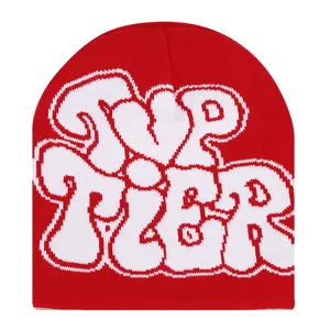 Red knit beanie with bold white letter design, warm winter streetwear cap for outdoor use.