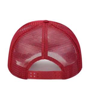 Close up view of the breathable red mesh trucker hat back strap detail and mesh structure.