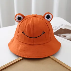 Cute orange frog cotton bucket hat with embroidered smile face and cute 3D eyes for outdoor sun.