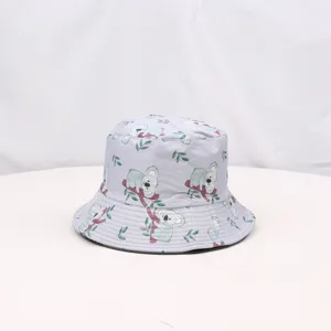 Close-up detail of grey bucket hat with cute koala print, soft summer sun protection fabric.