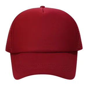 Close-up detail of the breathable mesh back and curved brim on the solid red baseball cap.