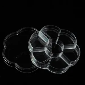 Boîte de rangement transparente en plastique en forme de fleur avec couvercle.