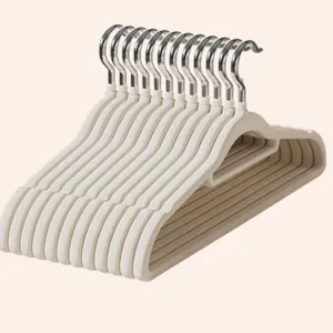 Flocked non-slip clothes hangers, beige durable garment hangers for home storage and drying.