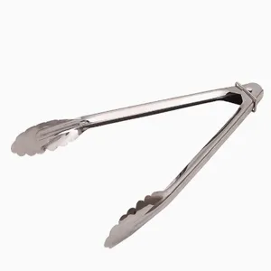 Close-up view of stainless steel food tong locking ring and scalloped grip head.