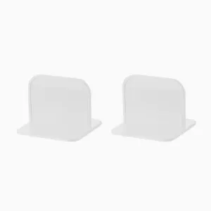 Detail view of white plastic wardrobe shelf divider anti-tip bracket, punch-free design.