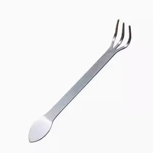 Stainless steel bonsai tool detail showing dual-end design with mini rake and flat spatula.