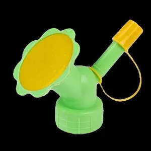 Dual-head bottle watering sprinkler detail view, plastic sunflower nozzle for garden use.
