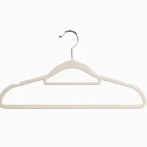 Beige flocked velvet clothes hanger with non-slip shoulders and chrome swivel hook for home.