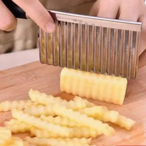 Stainless steel crinkle cutter for cutting potato chips, french fries, and wavy vegetables.