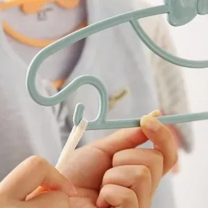 Children plastic clothes hanger with bow design, cute baby cloth drying rack main view.