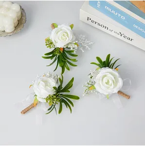 Artificial white rose boutonniere set with green leaves and twine for wedding groom and prom.