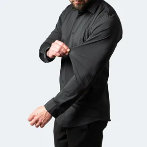 Detail shot of men's black long-sleeve shirt showcasing high elasticity and wrinkle-free stretch fabric.