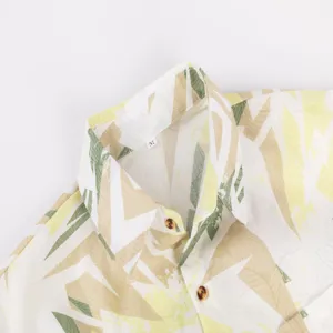 Men's tropical leaf print short sleeve hawaiian shirt detail view showing collar and buttons.