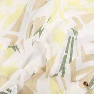 Men's casual short sleeve shirt detail, close-up of pocket and tropical leaf print fabric.