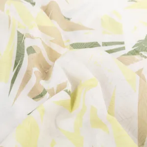 Detailed view of casual Hawaiian short sleeve shirt fabric with tropical leaf print.
