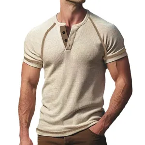 Detailed view of men's waffle knit short sleeve Henley shirt with contrast trim and button placket.