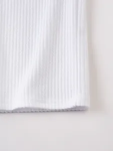 White ribbed knit fabric detail of men's fitness sports vest, soft texture closeup.