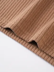 Men's knitted vertical stripe vest detail close-up fabric texture breathable casual top.