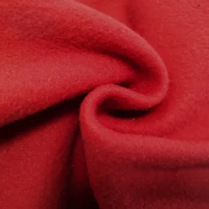 Red thick brushed fleece fabric detail close up shot for winter warm cargo sweatpants men apparel