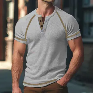 Mens waffle knit short sleeve henley t-shirt detail showing contrast trim and button placket.