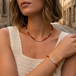 Handmade red beaded pearl splicing necklace bracelet set, elegant stackable jewelry detail.