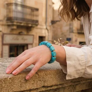 Detailed view of irregular square blue stone bracelet worn on wrist, minimalist everyday style.