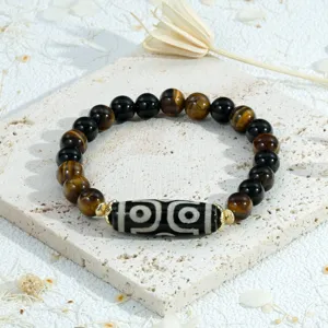 Tibetan style retro gemstone bracelet with tiger eye, black agate and Dzi bead details.