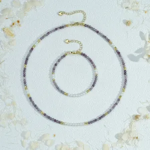 Delicate purple beaded and faux pearl layered necklace bracelet jewelry set for women.