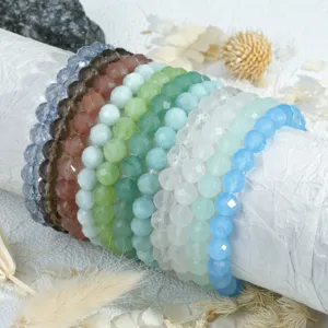 Faceted crystal bead bracelets detailed close up shot showing various pastel gemstone colors.