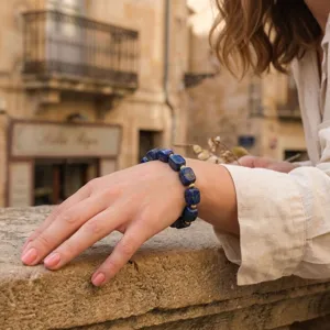 Detail shot of irregular square lapis lazuli bracelet with gold spacers for women daily wear.