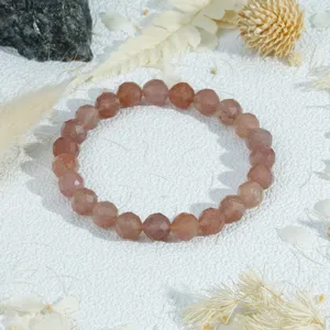 Close-up detail shot of faceted crystal bead bracelet showcasing natural texture and polish.
