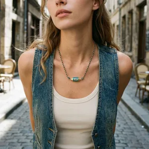 Handmade braided cord necklace featuring a colorful hexagonal evil eye pendant detail.