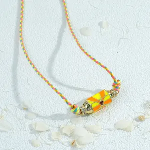Details of the vibrant colorful hexagonal prism pendant necklace with handmade woven cord.