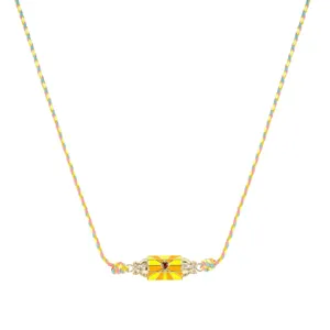 Colorful woven cord hexagonal prism pendant necklace detail close up view, fashion jewelry.