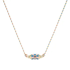 Close-up detail of the colorful woven rope necklace with a chic hexagonal enamel pendant.
