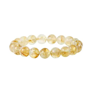 Gedetailleerd close-upweergave van de natuurlijke citrien kristalen kralen armband tekstuur.
