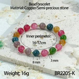 Kleurrijke natuurstenen kralenarmband met gouden tussenstukken, elegante dames sieraden.