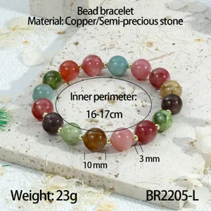 Detailopname van een kleurrijke edelsteen kralenarmband met koperen tussenstukken en afmeting.