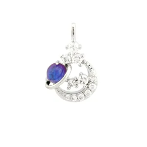 Crescent moon planet pendant decorated with sparkling cubic zirconia and shimmering purple stone.