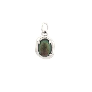 Detailed shot of metal setting pendant with sparkling iridescent oval gemstone accessory.