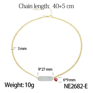 Gold tone stainless steel chain necklace featuring a paved letter tag and red heart pendant.