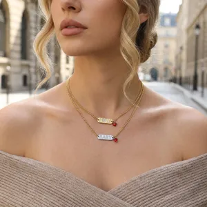 Chic double layer gold chain necklace with rhinestone letter tags and red heart pendant for women.