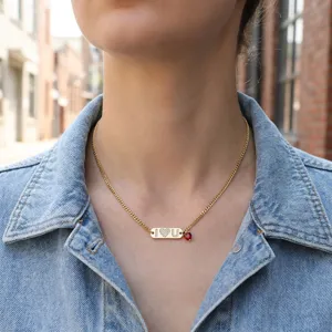 Gold-plated chain necklace with rhinestone bar pendant and red heart charm for women fashion daily.